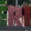 Students posing behind the MERIDA sign in Mexico